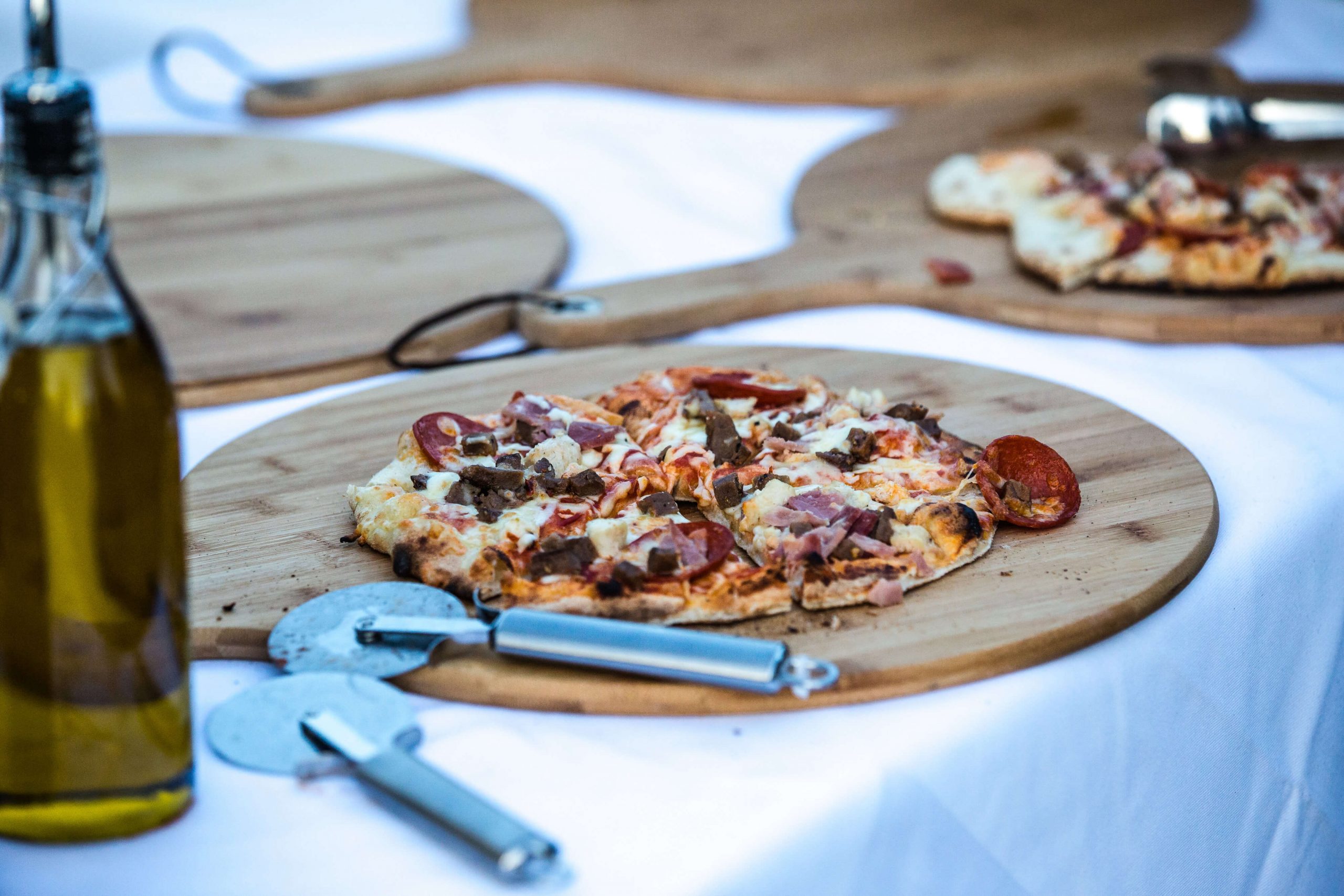 Individual Pizzas on wooden platters at Swynford Manor