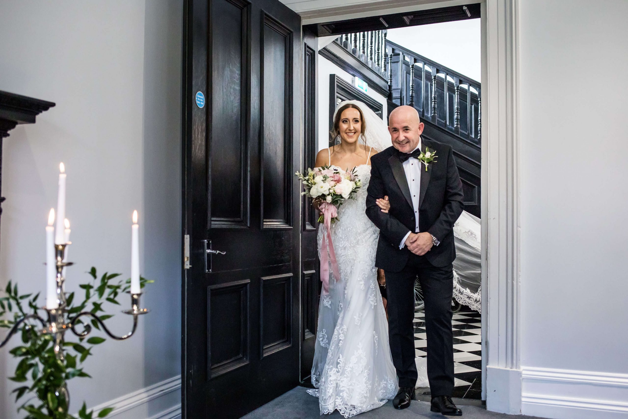 Bride and her father entering the Study to get married at Swynford Manor
